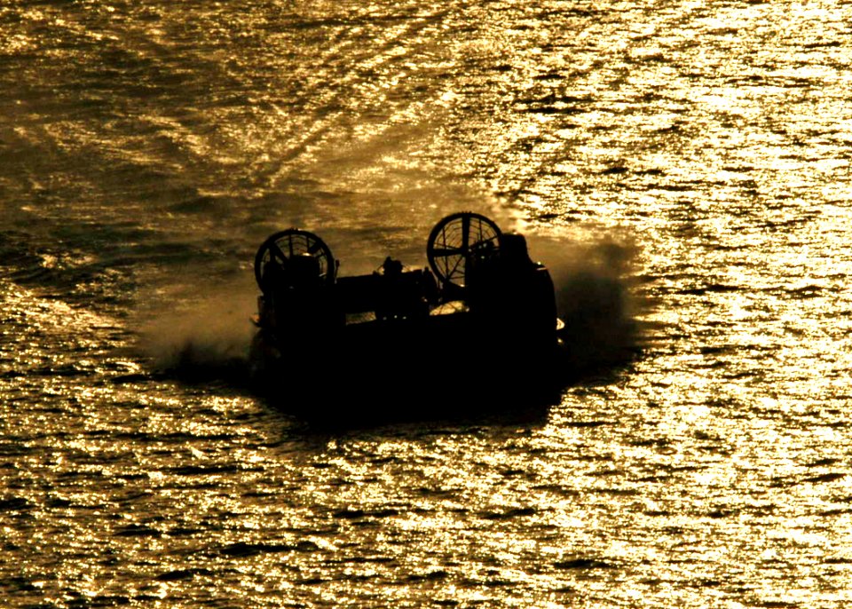 US Navy 040707-N-2972R-085 An Assault Craft Unit Four (ACU-4) Landing Craft Air Cushion (LCAC) transports elements of the 24th Marine Expeditionary Unit (MEU) from the amphibious assault ship USS Kearsarge (LHD 3) to the Kuwait