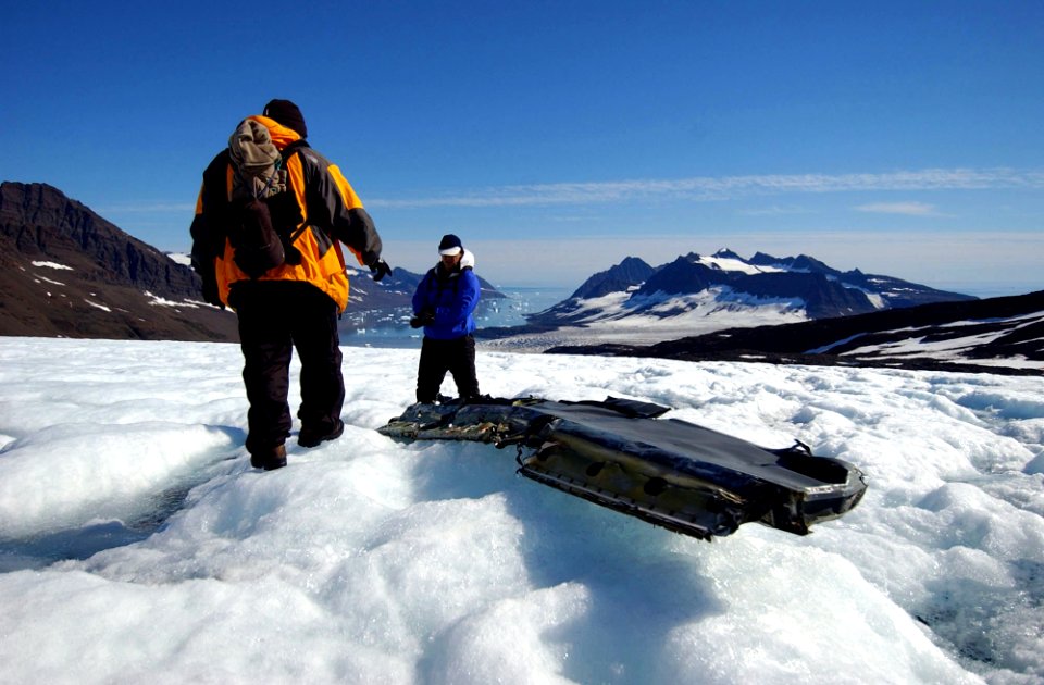 US Navy 040809-N-0331L-005 Lt. Cmdr. Christopher Blow, right, and Lt. Cmdr. Steve Dial examine the wreckage of a Navy P-2V Neptune aircraft that crashed over Greenland in 1962