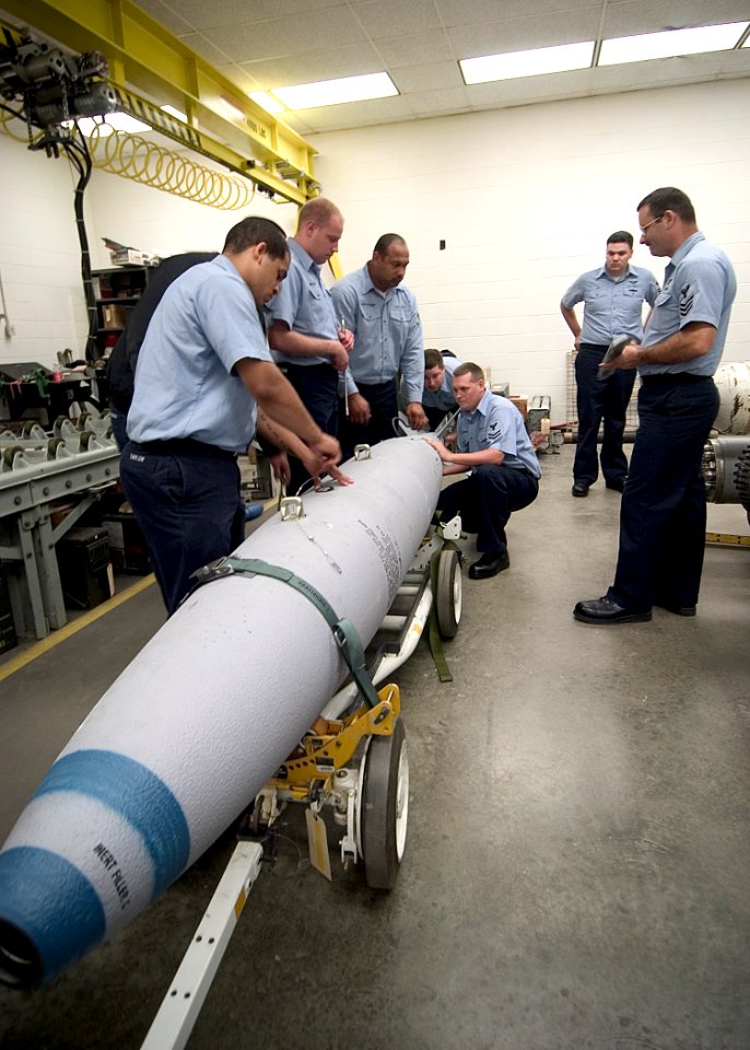 US Navy 040831-N-5134H-019 Students practice working with an inert practice bomb during a six week-long Air Launched Weapons course