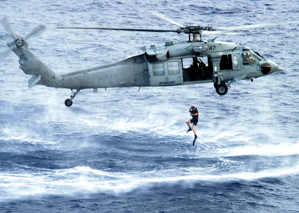 US Navy 040809-N-2972R-039 An air crew member assigned to Helicopter Combat Support Squadron Eight (HC-8) participates in a Search and Rescue (SAR) training exercise