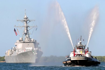 US Navy 040910-N-3228G-001 The Navy's newest and most advanced Arleigh Burke-class guided missile destroyer USS Chung-Hoon (DDG 93) is welcomed into her new homeport of Pearl Harbor, Hawaii, by a tugboat's water can