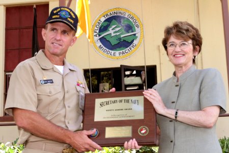 US Navy 040713-N-3228G-002 Deputy Assistant Secretary of the Navy (Safety) Connie DeWitte presents the 2003 Secretary of the Navy Achievement in Safety Ashore Award to Commander, Afloat Training Group, Middle Pacific (ATG MIDPA