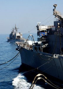 US Navy 040917-N-4374S-010 Guided missile cruiser USS Vicksburg (CG 69) pulls away from the fast combat ship USS Seattle (AOE 3) after completing an underway replenishment in the Arabian Gulf