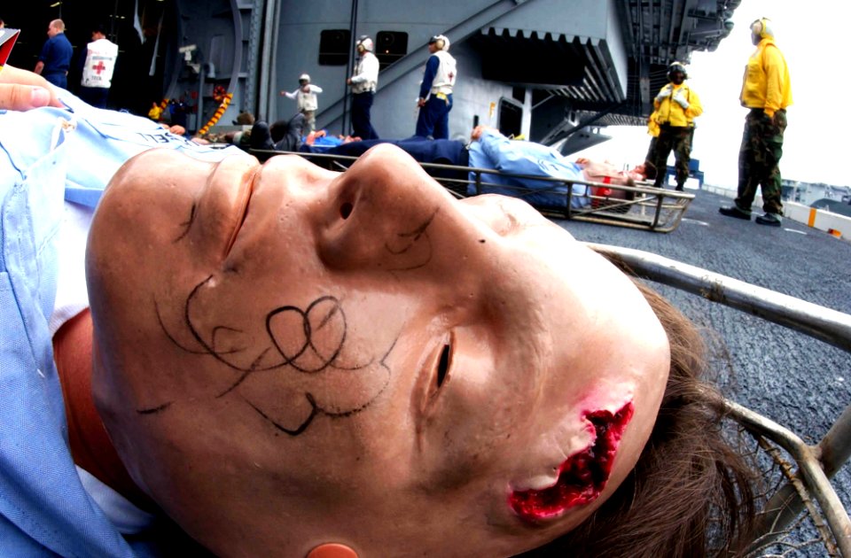 US Navy 040821-N-8158F-056 Crew member, Melissa Russell from Jacksonville, Miss., participates in a mass casualty drill aboard the nuclear powered aircraft carrier USS Nimitz (CVN 68)