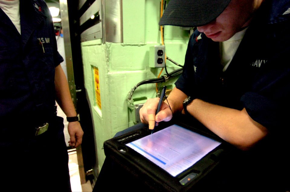 US Navy 040823-N-2653P-017 Machinist Mate 3rd Class Steven Savoie studies ships qualifications during Bravo Trials aboard PCU Virginia (SSN 774)