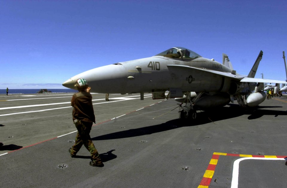 US Navy 040824-N-9319H-024 A plane captain prepares an F-A-18C Hornet assigned to Strike Fighter Squadron Nine Four (VFA-94) for a full day of flight operations aboard the aircraft carrier USS Nimitz (CVN 68)