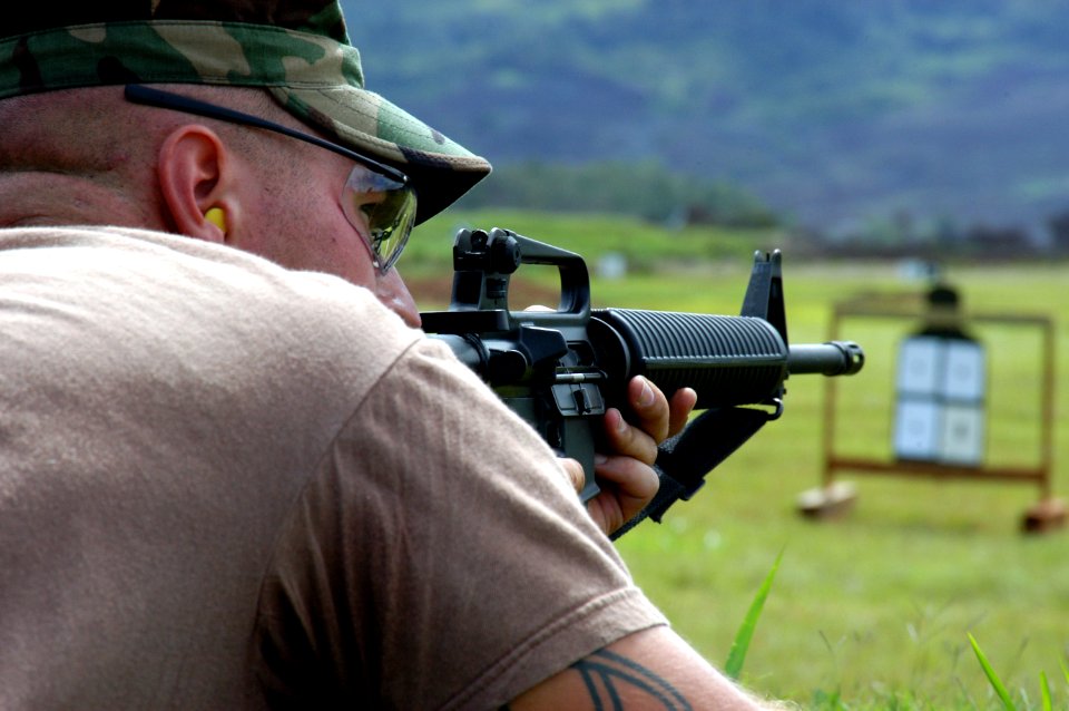 US Navy 040816-N-3019M-003 Steelworker 2nd Class Joshua Scaturo assigned to Naval Mobile Construction Battalion Four One Three (NMCB-413) waits for the starting whistle to requalify on an M-16