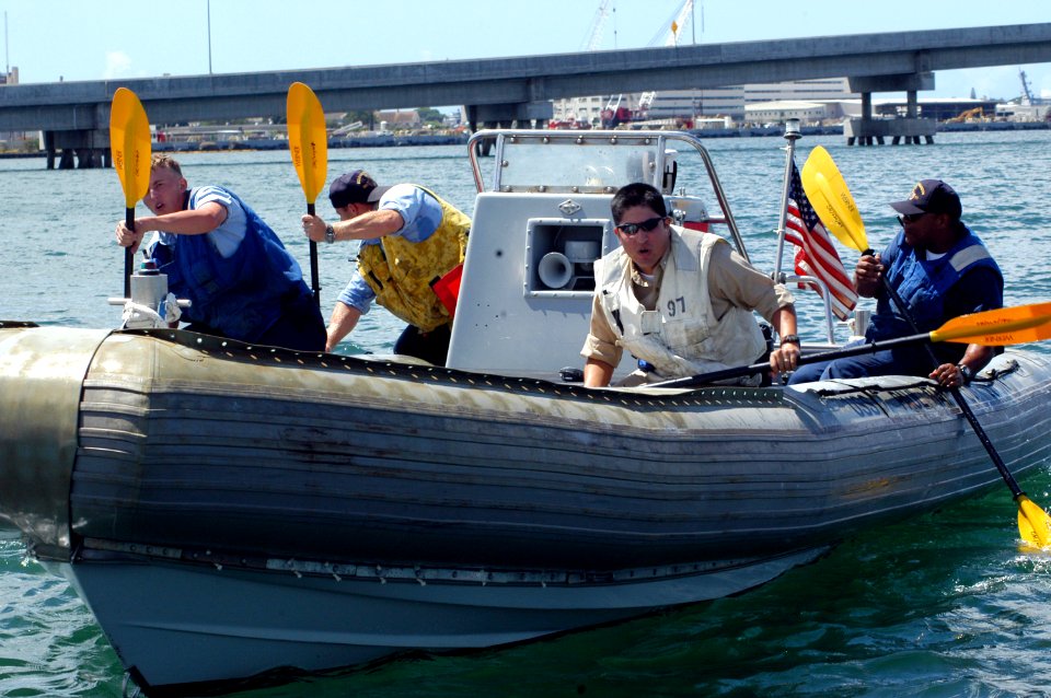 US Navy 040924-N-3019M-003 Sailors attached to the guided missile destroyer USS Paul Hamilton (DDG 60) paddle toward the finish line in a Rigid Hull Inflatable Boat (RHIB)
