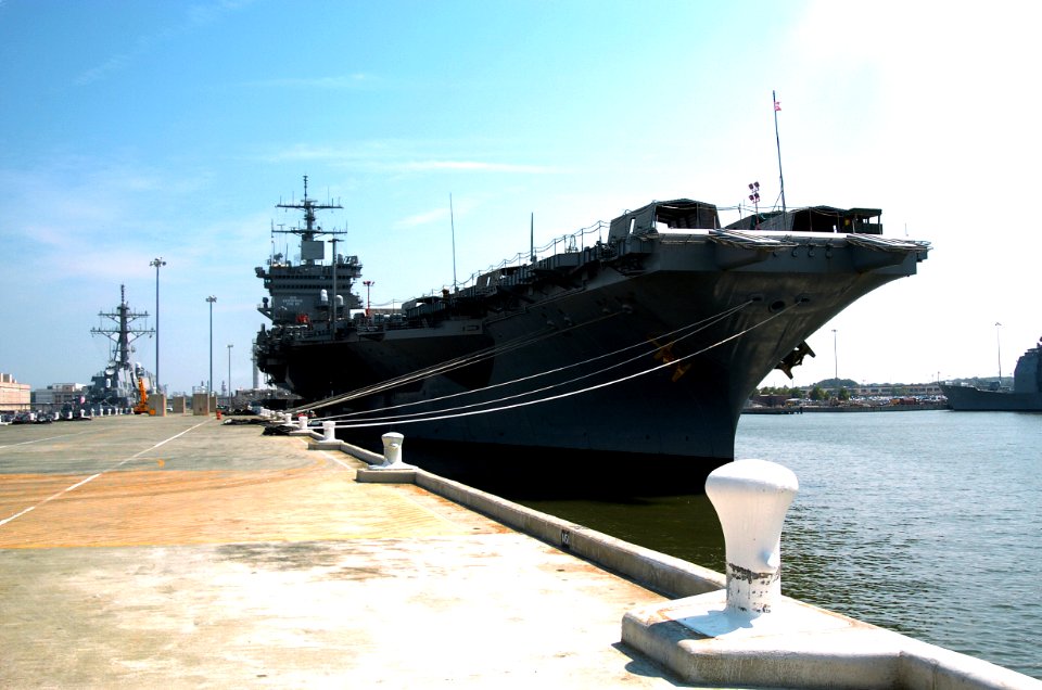 US Navy 040902-N-1464F-001 The nuclear powered aircraft carrier USS Enterprise (CVN 65) shown moored at pier six, aboard Naval Station Norfolk