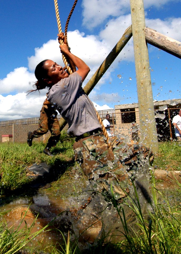 US Navy 040820-N-3019M-012 A chief petty officer (CPO) selectee swings over a water pit at the Fleet Marine Force (FMF) Challenge