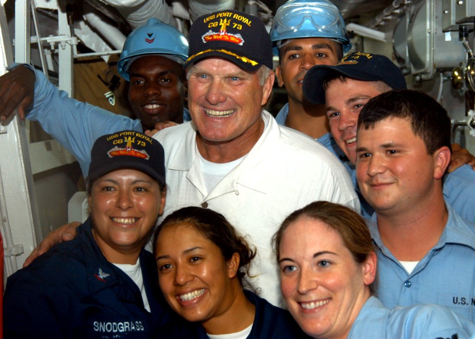 US Navy 040902-N-3019M-011 National Football League (NFL) Hall of Fame quarterback Terry Bradshaw poses with Sailors during a visit aboard the guided missile cruiser USS Port Royal (CG 73)