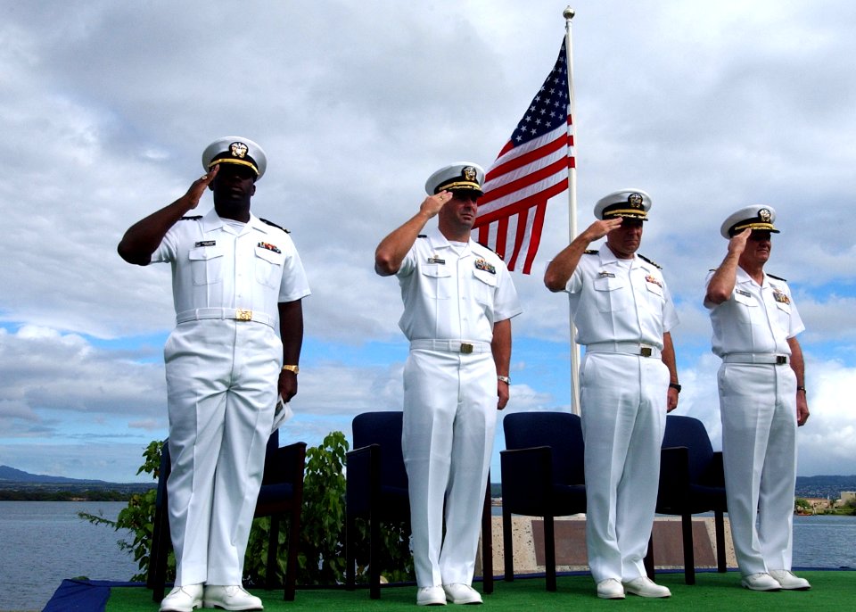 US Navy 040930-N-3019M-001 Members of the official party salute in front of the USS Nevada Memorial during the national anthem at a ceremony that established Naval Security Group Activity (NSGA), Hawaii
