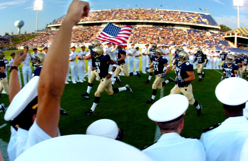 US Navy 040904-N-9693M-003 The U.S. Naval Academy Midshipman Football team runs onto the field to take on the Duke Blue Devils