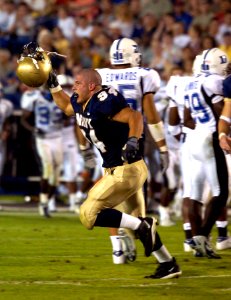 US Navy 040904-N-9693M-011 U.S. Naval Academy Midshipman 3rd Class Anthony Piccioni celebrates after a play against the Duke Blue Devils