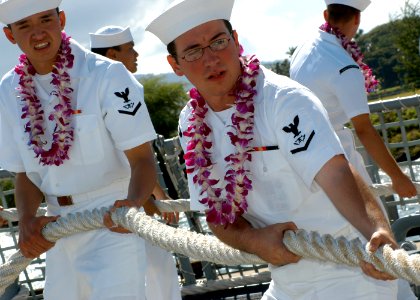 US Navy 040910-N-3019M-009 Sailors aboard the Navy's newest and most advanced Arleigh Burke-class guided missile destroyer USS Chung-Hoon (DDG 93), take up slack on a mooring line