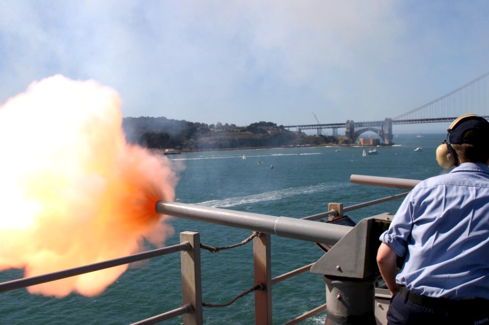 US Navy 041009-N-2379C-070 Gunner's Mate Seaman William Sanders, of San Jose, Calif., fires a 40mm Saluting Battery from the signal bridge aboard the amphibious assault ship USS Tarawa (LHA 1)