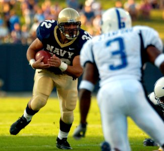 US Navy 040904-N-9693M-004 U.S. Naval Academy Midshipman 1st ClassKyle Eckel runs for a touchdown against the Duke Blue Devils. Eckel rushed for 100 yards and two touchdowns to help Navy beat Duke 27-12 in the season opener for