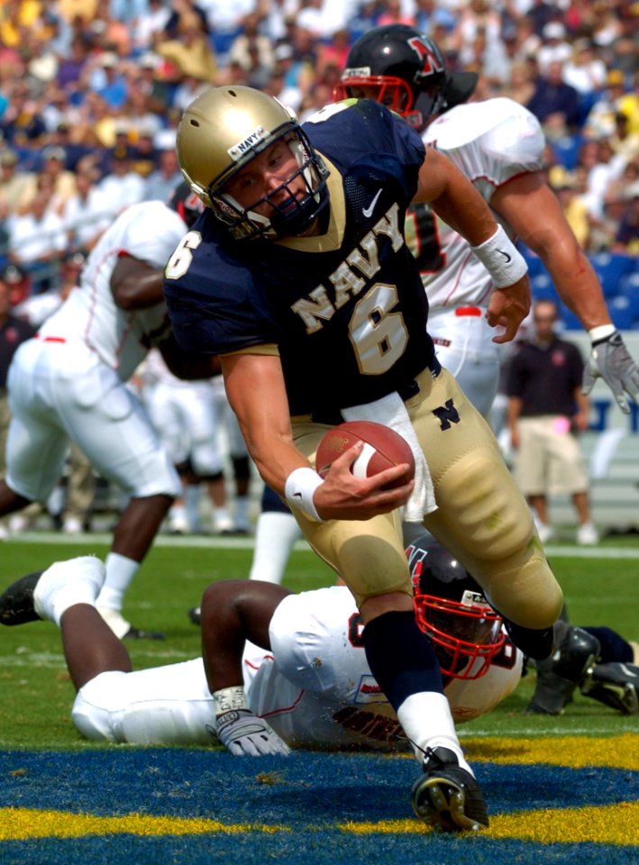 US Navy 040911-N-9693M-013 U.S. Naval Academy Midshipman 1st Class Aaron Polanco runs for a touchdown against the Northeastern Huskies