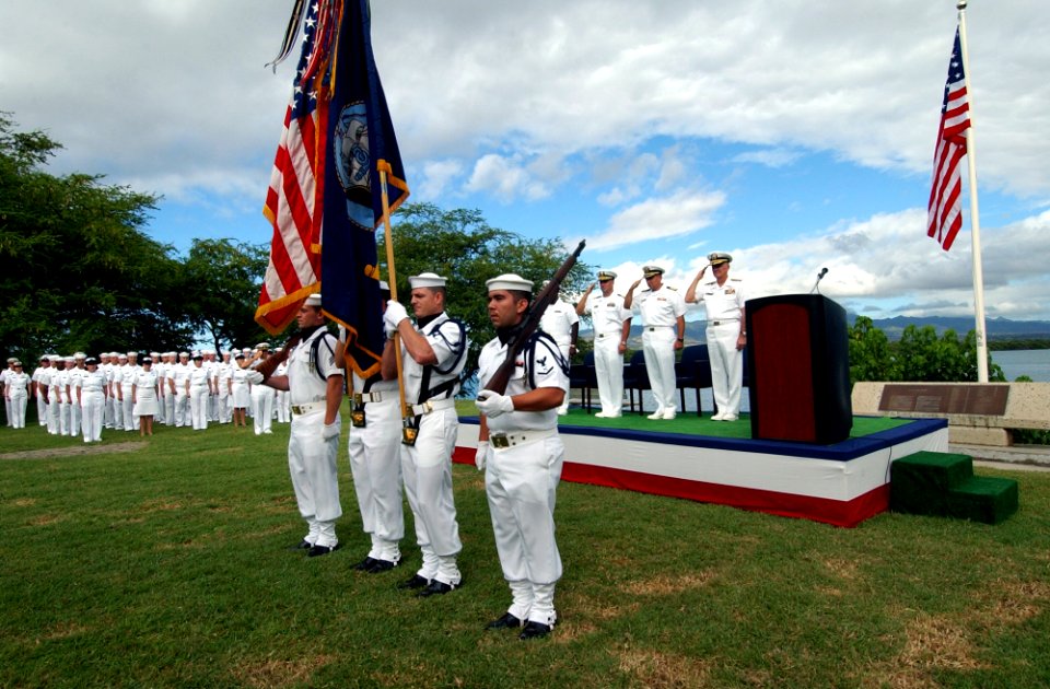 US Navy 040930-N-3019M-002 A Naval Station Pearl Harbor color guard parades the colors in front of the USS Nevada Memorial at a ceremony to formally establish Naval Security Group Activity (NSGA), Hawaii