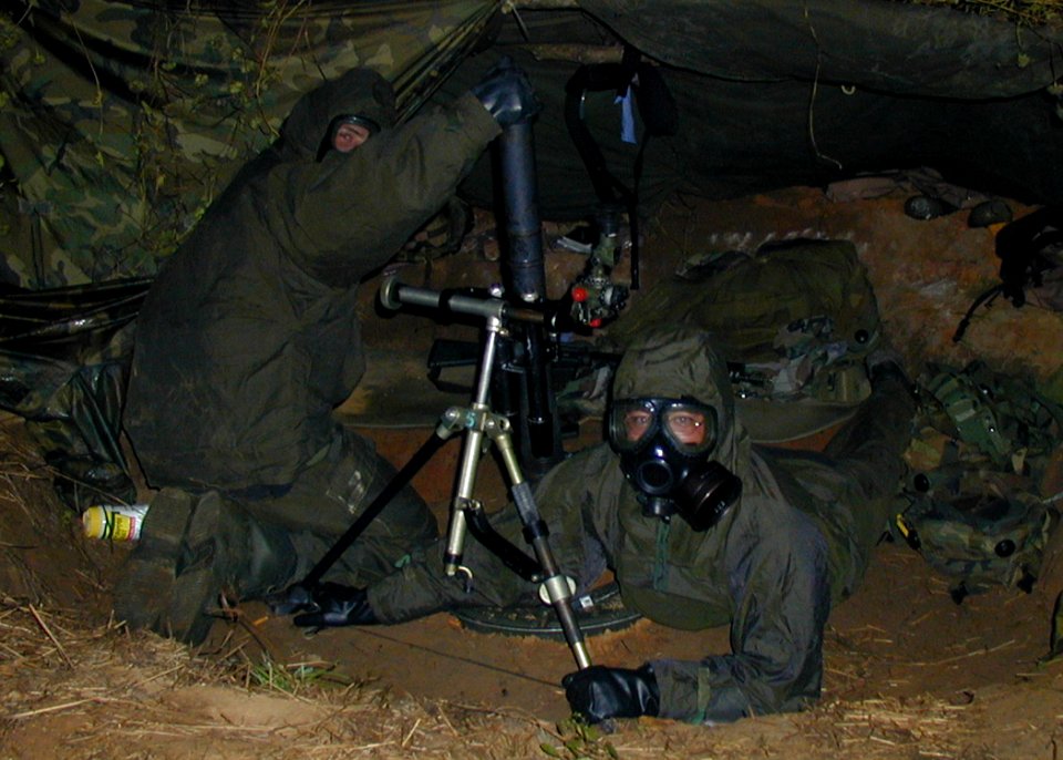 US Navy 041029-N-5526M-002 Seabees assigned to Naval Mobile Construction Battalion One (NMCB-1) conduct tear gas attack training during field exercise Operation Gulf Mist