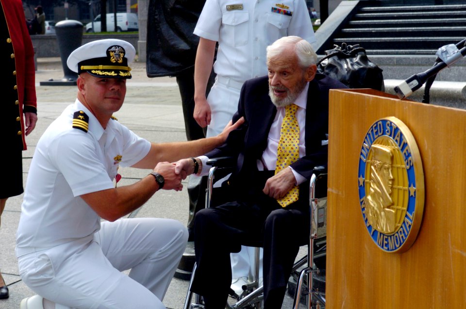 US Navy 040930-N-0295M-003 Cmdr. Michael Hegarty shakes the hand of Former Secretary of the Navy Paul H. Nitze, after he was presented a Bronze Star at a ceremony held at the U.S. Navy Memorial in Washington, D.C