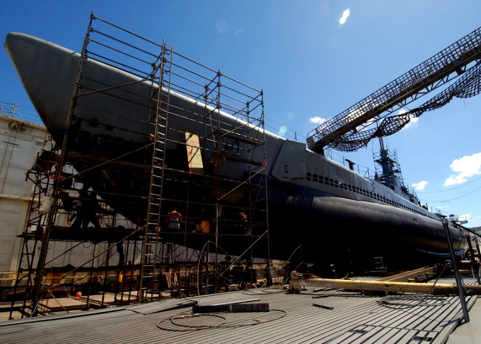 US Navy 041005-N-3019M-004 Marisco Ltd. workers repair the aging hull of the decommissioned Balao-class submarine USS Bowfin (SS 287)