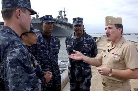 US Navy 041018-N-0962S-293 Master Chief Petty Officer of the Navy (MCPON) Terry Scott talks with the Sailors modeling the Navy's new working uniform concepts in Norfolk, Va