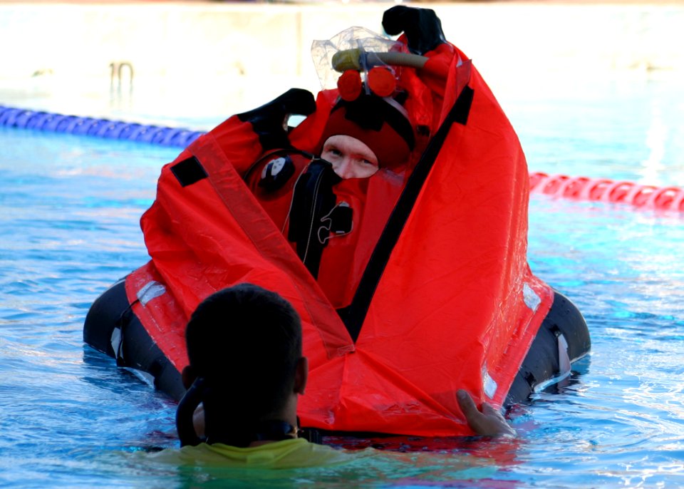 US Navy 041012-N-0879R-007 A Sailor assigned to the Los Angeles-class attack submarine USS Key West (SSN 722), receives training with the MK10 Submarine Escape Immersion Equipment (SEIE)