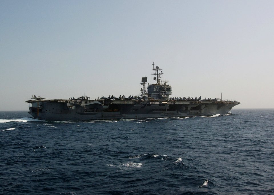 US Navy 041026-N-4374S-012 The conventionally powered aircraft carrier USS John F. Kennedy (CV 67) sails away after completing a replenishment at sea in the Arabian Gulf