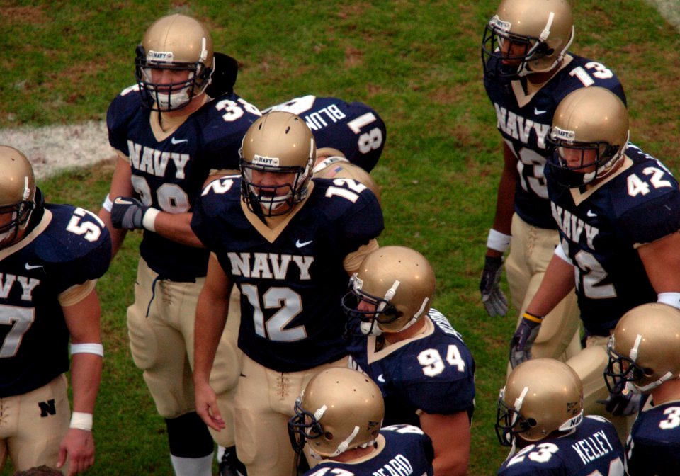 US Navy 041030-N-9693M-014 U.S. Naval Academy Midshipman 1st Class John McLaughlin (12) wears 1963 Heisman Trophy winner Roger Staubach's number during Navy's game against the Delaware Blue Hens