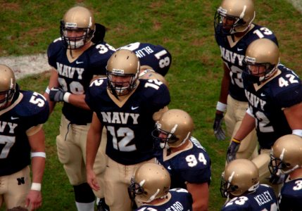 US Navy 041030-N-9693M-014 U.S. Naval Academy Midshipman 1st Class John McLaughlin (12) wears 1963 Heisman Trophy winner Roger Staubach's number during Navy's game against the Delaware Blue Hens