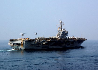 US Navy 041031-N-4374S-004 SA-330 Puma helicopters assigned to the Military Sealift Command (MSC) combat stores ship USNS Saturn (T-AFS 10) transport cargo to the aircraft carrier USS John F. Kennedy (CV 67)