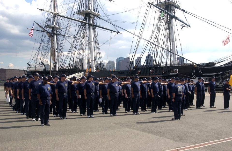 US Navy 040901-N-0962S-109 Chief petty officer (CPO) selectees dress off in formation while preparing for marching drills next to the U.S. Navy's sail ship USS Constitution