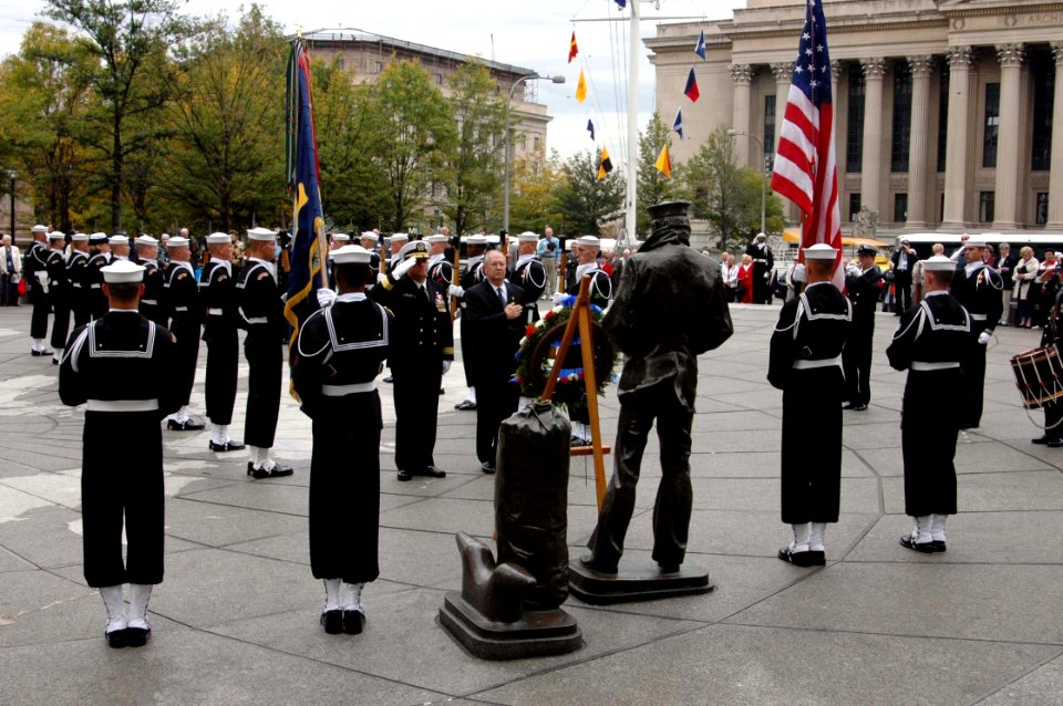 US Navy 041013-N-2147L-001 Commander, Naval District Washington, Rear Adm. Jan C. Gaudio, and President and CEO of the U.S Navy Memorial Foundation, Retired Rear Adm. Pierce J. Johnson, place a wreath in front of The Lone Sailo