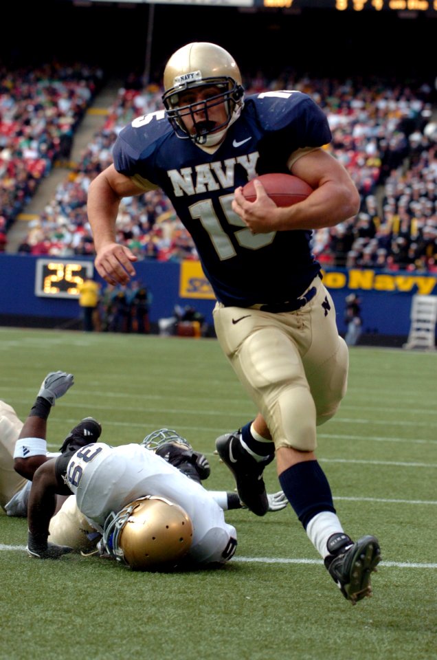 US Navy 041016-N-9693M-020 U.S. Naval Academy Midshipman 1st Class Frank Divis outpaces Notre Dame linebacker Brandon Hoyte for the Midshipmen's only touchdown of the game at Giants Stadium in East Rutherford, N.J