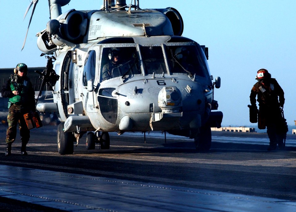 US Navy 041129-N-6363M-004 Personnel remove the wheel chocks of an HH-60H Seahawk