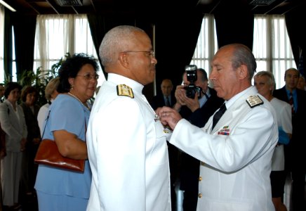US Navy 041108-N-0000X-001 Argentinean Chief of Naval Operations, Adm. Jorge Godoy, right, presents the Distinguished Service Naval Cross to Commander, U.S. Naval Forces Southern Command, Rear Adm. Vinson E. Smith