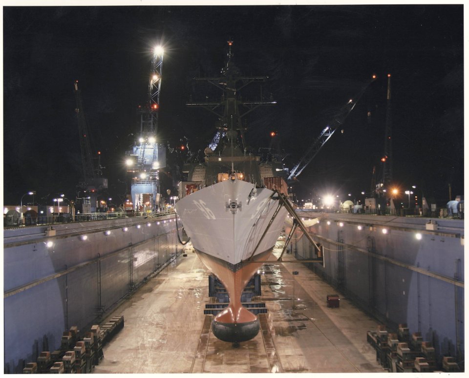 US Navy 041112-N-0024B-002 The Arleigh Burke Flight IIA-class guided missile destroyer PCU Bainbridge (DDG 96) shown in dry dock at the Bath Iron Works shipyard in Bath, Maine
