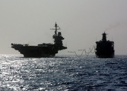 US Navy 041026-N-4374S-001 The conventionally powered aircraft carrier USS John F. Kennedy (CV 67) receives fuel lines from the Military Sealift Command (MSC) underway replenishment oiler USNS Guadalupe (T-AO 200) photo