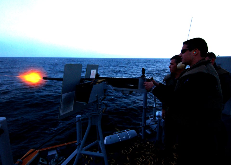 US Navy 041113-N-0331L-010 Ens. Eduardo Sanchez from Argentine ship ARA Spiro (P 43), fires a .50 caliber machine gun aboard the Oliver Hazard Perry class frigate USS Dewert (FFG 45) as part of a gunnery exercise during UNITAS