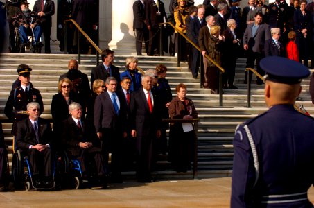 US Navy 041111-G-3024G-775 Deputy Secretary of Defense, Paul Wolfowitz, center left, and Secretary of State Colin Powell, pay their respects to the unknown servicemen laid to rest at the Tomb of the Unknowns