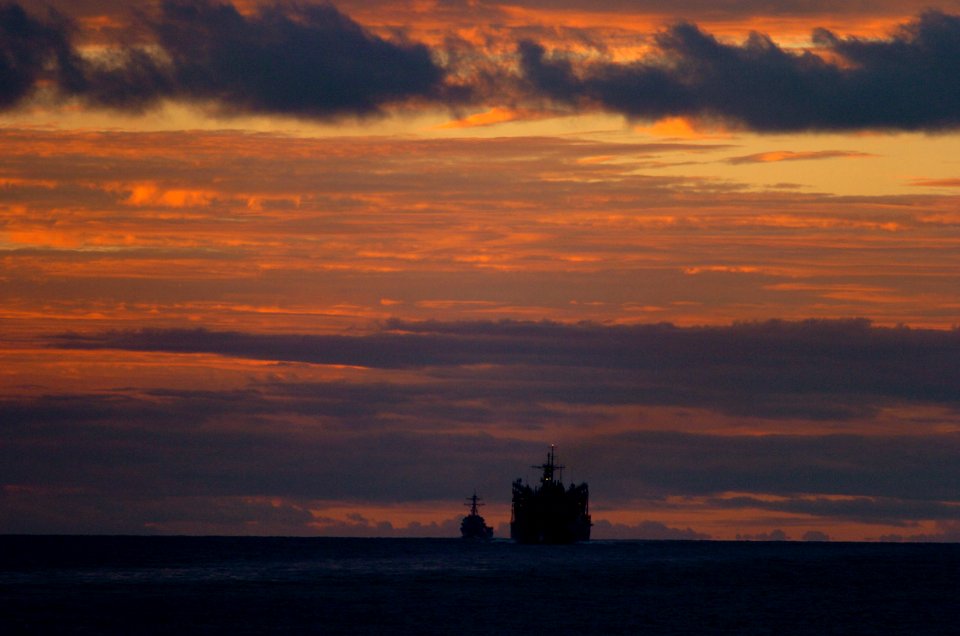 US Navy 040917-N-6213R-008 Guided missile destroyer USS Howard (DDG 83), left, and fast combat support ship USNS Rainier (T-AOE 7) cruise in formation