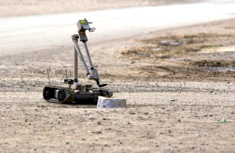 US Navy 041103-N-4614W-033 A U.S. Army explosive ordnance disposal (EOD) robot, i-Robot, pulls the wire of an alleged improvised explosive device (IED), found by the Iraqi Police