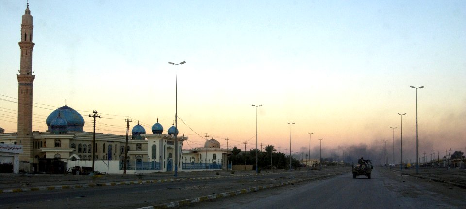 US Navy 041213-N-4614W-036 Smoke rises from sporadic fighting between U.S. Marines and insurgents inside the city of Fallujah, Iraq