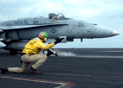 US Navy 041209-N-6363M-005 Lt. cmdr. Brian Weiss launches an F-A-18A- Hornet assigned to the Silver Eagles of Marine Fighter Attack Squadron One One Five (VMFA-115)
