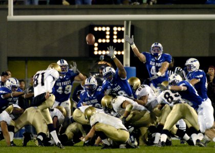 US Navy 041001-F-0000S-002 Navy kicker Geoff Blumenfeld gives Air Force the boot, kicking a field goal with four seconds left in the game