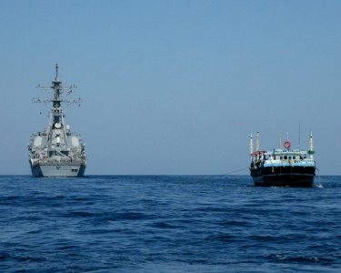 US Navy 041117-N-8447S-001 The guided missile destroyer USS TheSullivans (DDG 68) provides rescue and assistance to the Pakistani dhow, Al Suleman