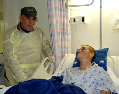 US Navy 041222-N-0357S-002 Actor and former Marine R. Lee Ermey, well known for his role as Gunnery Sgt. Hartman in the film Full Metal Jacket and the television show Mail Call, shares a laugh with Lance Cpl. Luke Connally