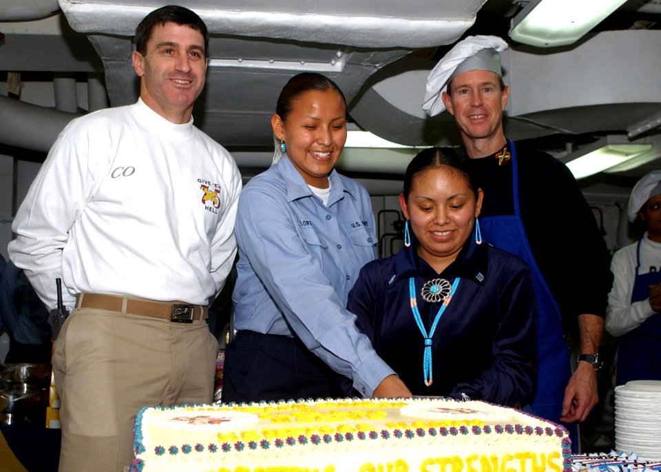 US Navy 041130-N-6363M-009 Capt. James Gigliotti, Capt. Paul Monger, Fireman Apprentice Louchelle Loretto and Fireman Apprentice Andrea Barney participate in a Native American Heritage Month cake-cutting ceremony