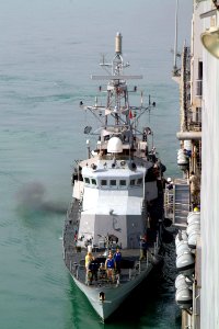 US Navy 041224-N-4772B-095 The coastal patrol ship USS Chinook (PC 9) prepares to moor alongside the dock landing ship USS Harpers Ferry (LSD 49) to conduct a replenishment at sea
